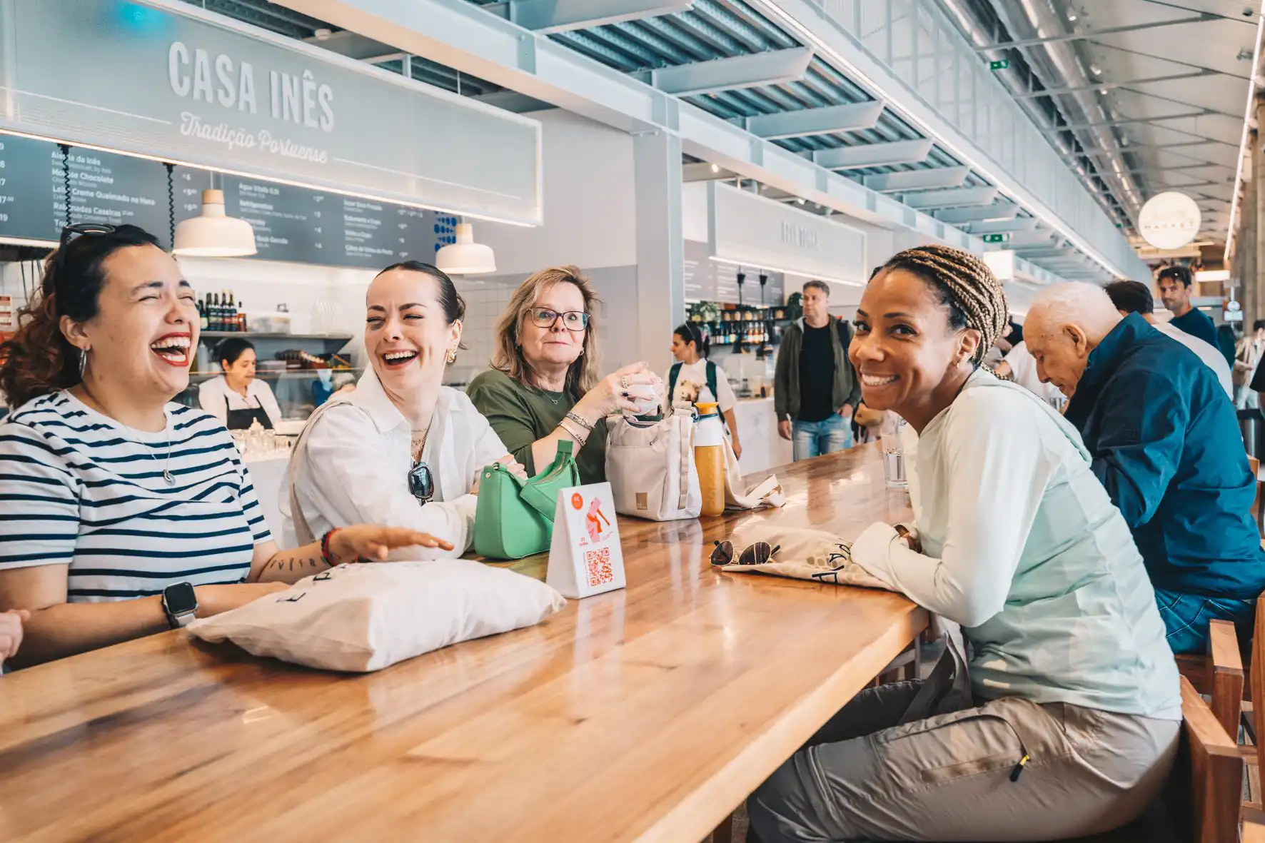 Canto Cooking guests at a Porto market food counter