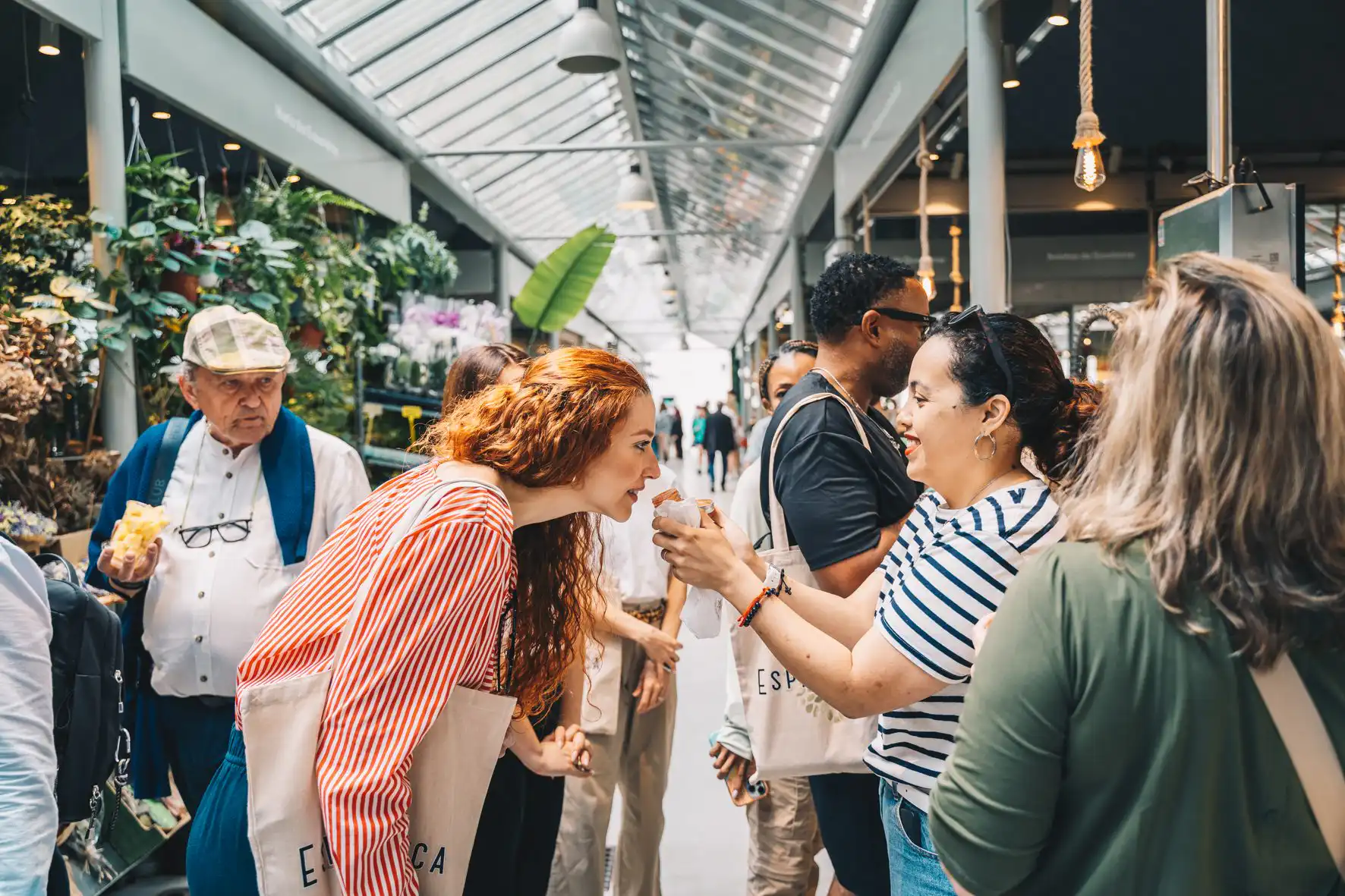 Guests eating Portuguese pastries in a Porto market on a food tour