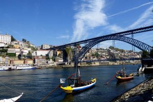 Luís I Bridge arching over the Douro River with Porto's Ribeira district in the background