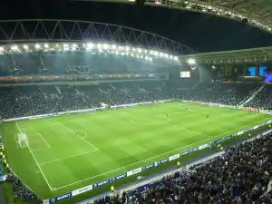 A floodlit night match at Estadio do Dragao with a full crowd in the stands
