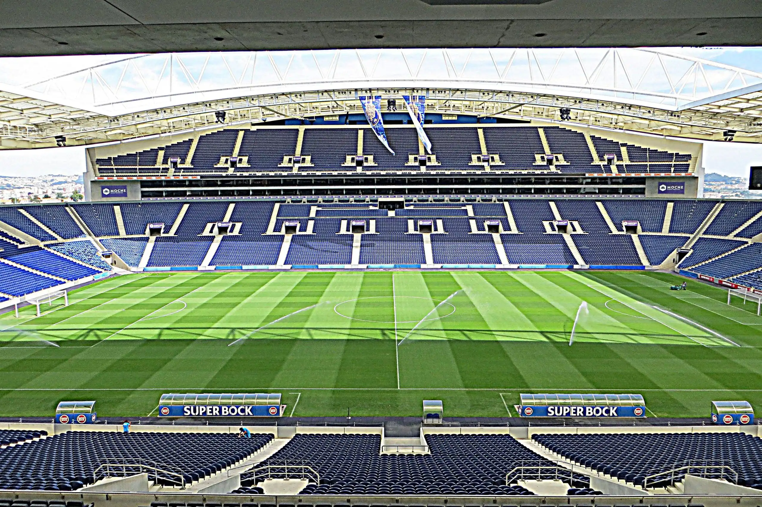 The blue and white tiered stands and pitch inside Estadio do Dragao, FC Porto home stadium